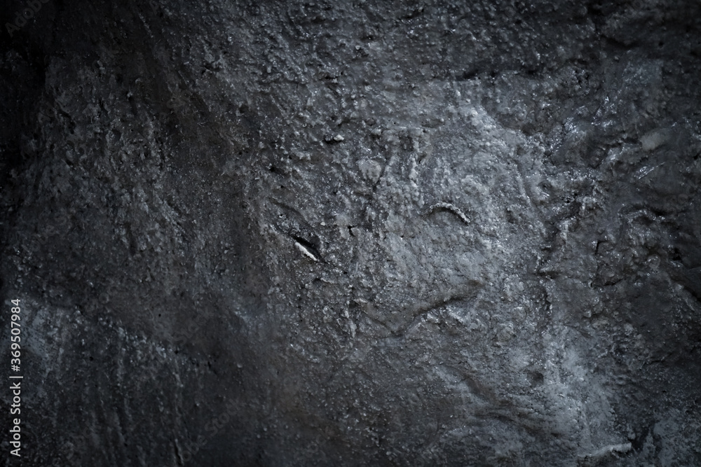 surface of the cave rock wall. gray stone texture background. surface of the cave rock wall. gray stone texture background.