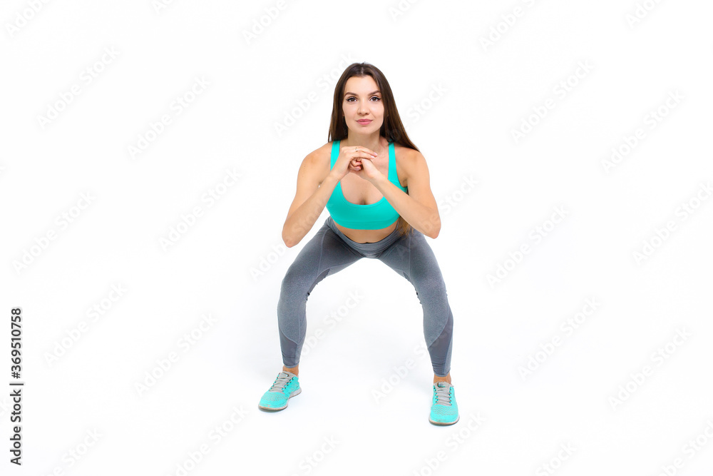 Sports girl doing workout on a white background Sports girl doing workout on a white background