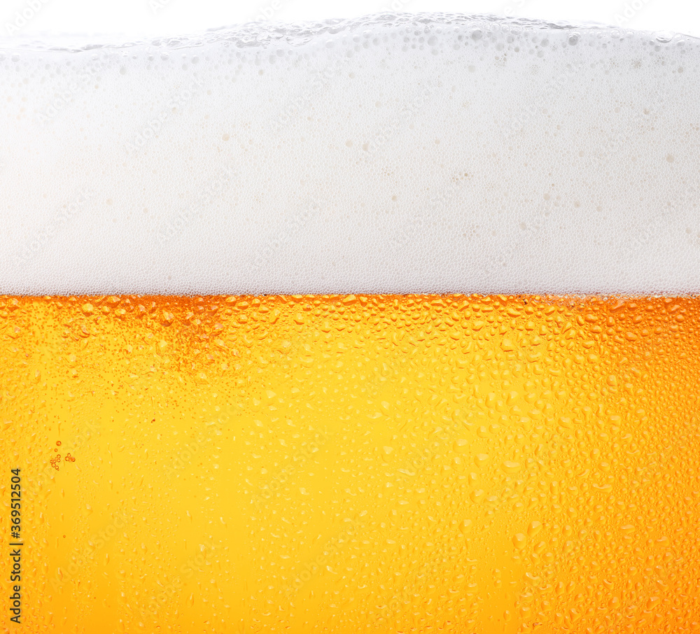 Close up background of beer with bubbles in glass Close up background of beer with bubbles in glass