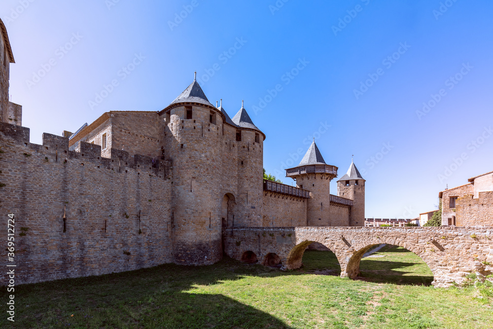 The old bridge over the moat leading to the castle of Carcassonne town