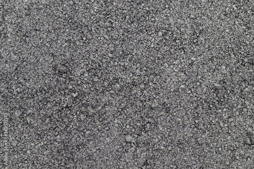 Black asphalt surface. Black rough texture background.