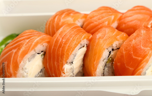 Take away set of salmon sushi rolls on white