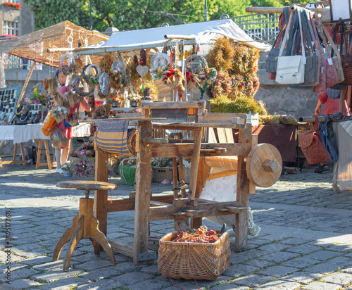 Ancient weaving loom displayed at Naplavka street food market at Prague photo