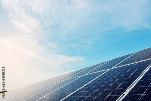 Photovoltaic power plant. Solar photovoltaic panels on blue sky background