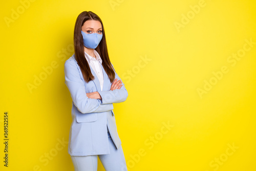 Photo confident boss company owner marketer girl cross hands dont afraid covid infection wear medical mask blue blazer jacket pants trousers isolated copyspace bright shine color background