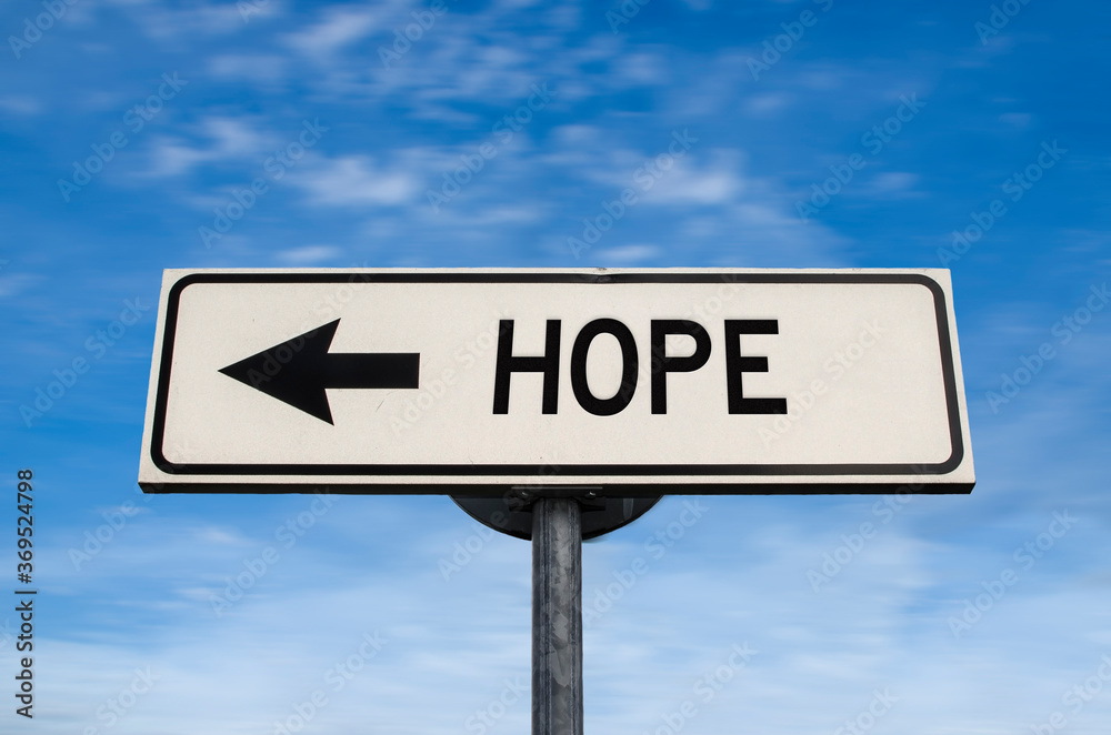 Hope road sign, arrow on blue sky background. One way blank road sign with copy space. Arrow on a pole pointing in one direction. Hope road sign, arrow on blue sky background. One way blank road sign with copy space. Arrow on a pole pointing in one direction.