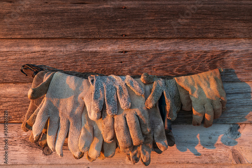 Fishermen gloves drying on wall in Fishtown in Leland Michigan photo