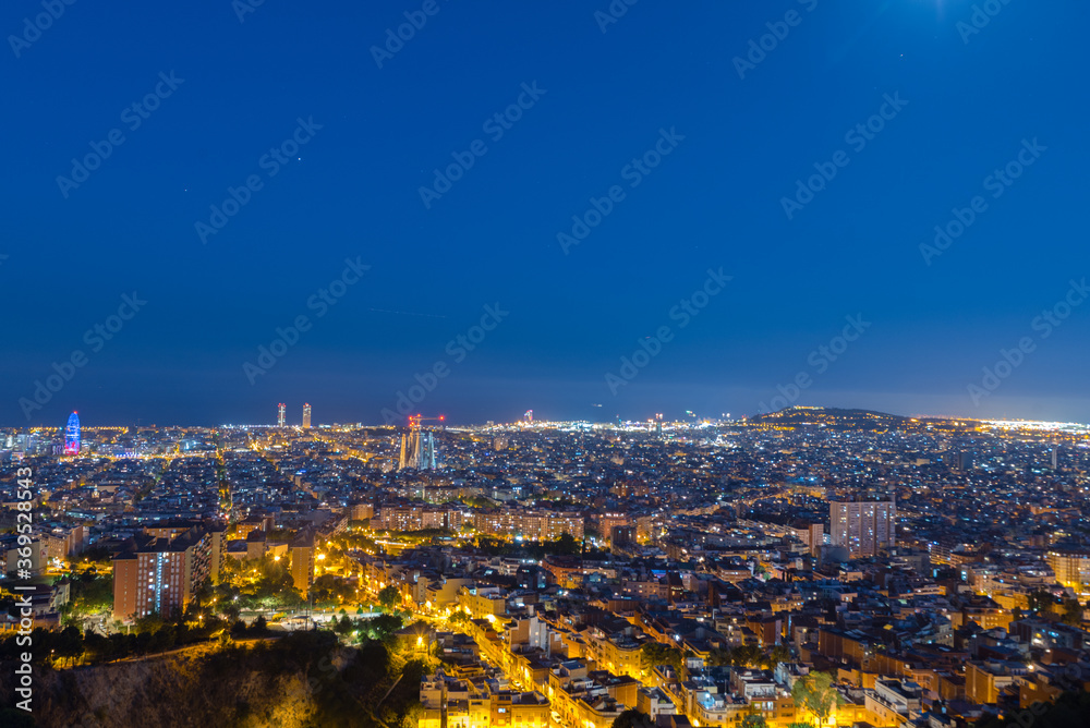 View of Barcelona city and costline in spring from the Bunkers in Carmel in the night.
