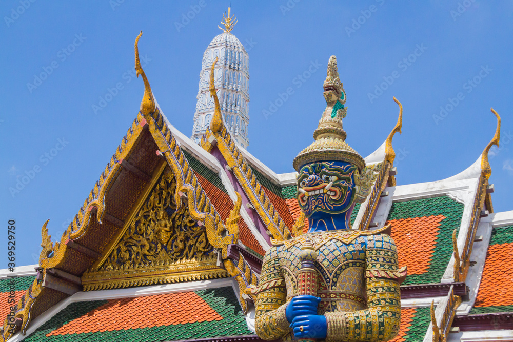 Closeup of one of the yaksha (giants) statue named Wirunhok guarding the Emerald Buddha (Wat Phra Kaew) temple gate in Bangkok, Thailand in the Grand Palace complex