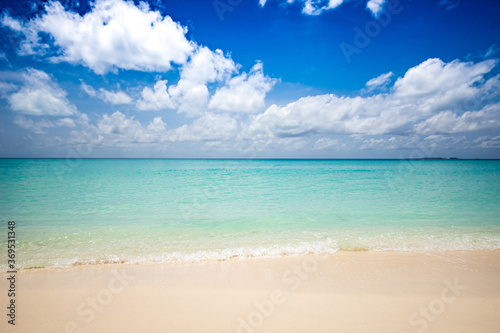 Tropical Beach with Blue Sky and Clouds