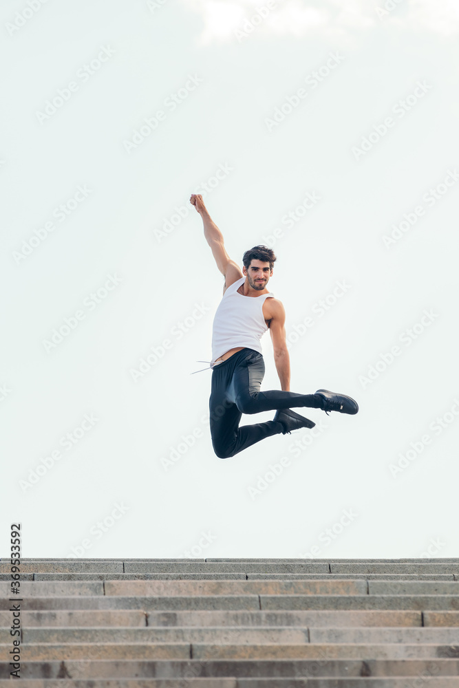 handsome sportsman jumping up celebrating success handsome sportsman jumping up celebrating success