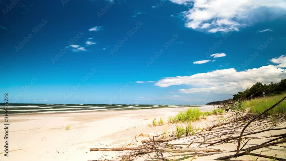 Beach Timelapse Blue Sky and White Clouds Over Sandy Beach. Baltic Sea, Poland. Beach Timelapse Blue Sky and White Clouds Over Sandy Beach. Baltic Sea, Poland.