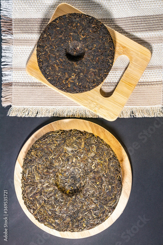 Chinese puer shu and shen in the form of pancakes. top view, vertical photo photo