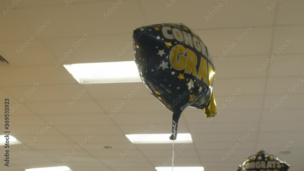 Medium shot of student graduation celebration balloon