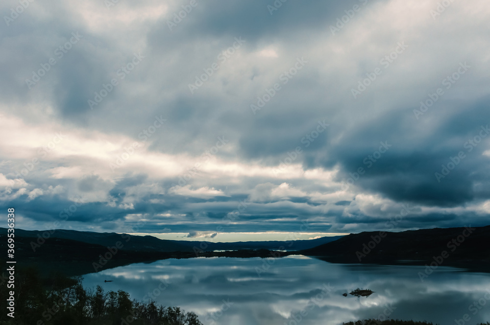 Low lead clouds over a lake in Norway
