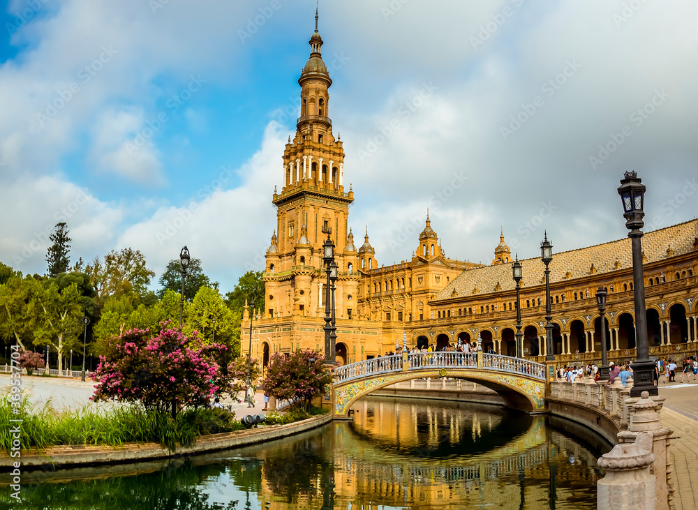 A view along a canal towards the northern side of the Plaza de Espana in Seville, Spain in the stillness of the early morning in summertime