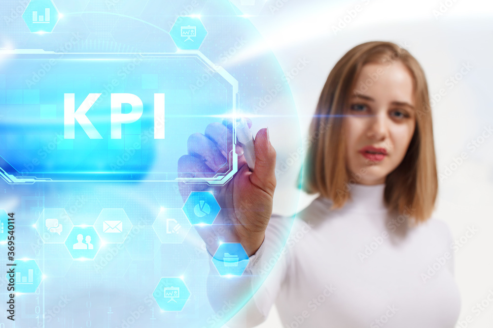 Business, Technology, Internet and network concept. Young businessman working on a virtual screen of the future and sees the inscription: KPI Business, Technology, Internet and network concept. Young businessman working on a virtual screen of the future and sees the inscription: KPI