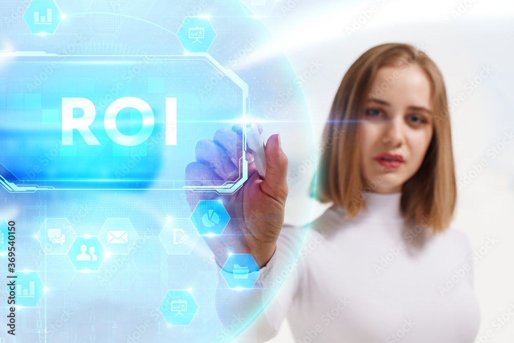 Business, Technology, Internet and network concept. Young businessman working on a virtual screen of the future and sees the inscription: ROI