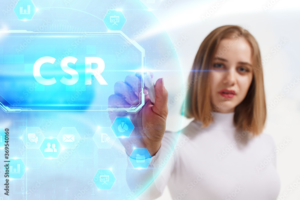 Business, Technology, Internet and network concept. Young businessman working on a virtual screen of the future and sees the inscription: CSR Business, Technology, Internet and network concept. Young businessman working on a virtual screen of the future and sees the inscription: CSR