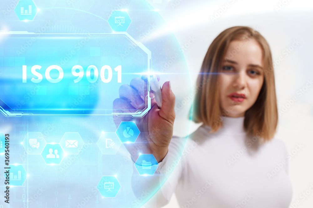 Business, Technology, Internet and network concept. Young businessman working on a virtual screen of the future and sees the inscription: ISO 9001 Business, Technology, Internet and network concept. Young businessman working on a virtual screen of the future and sees the inscription: ISO 9001