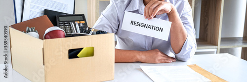 Business woman has frustrated and stressed to resignation and signing cancellation contract letter