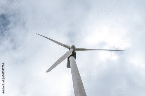 Wind turbine against sky © Ruben Chase