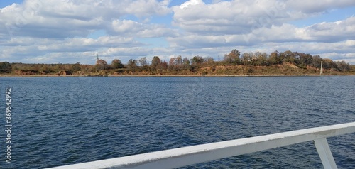 View off of a boat of autumn trees