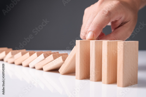 Hand Stop Falling Wood Domino