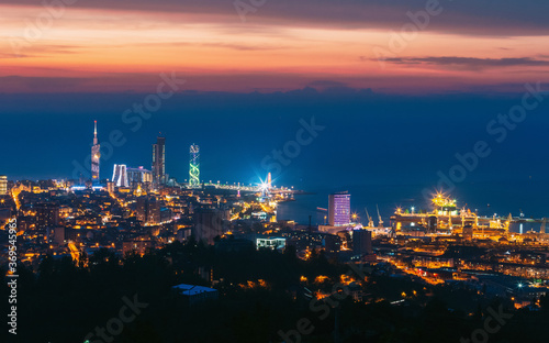 Batumi  Adjara  Georgia. Aerial View Of Urban Cityscape At Sunset. Town At Evening Blue Hour time. City In Night Lights Illuminations