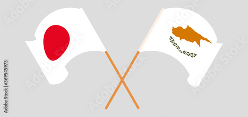 Crossed and waving flags of Cyprus and Japan