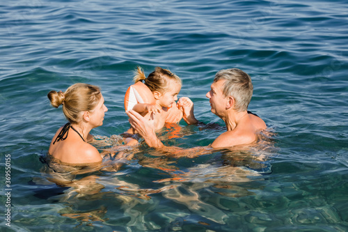 Family playing in sea