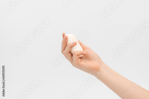 Bar of soap in a woman's hand.