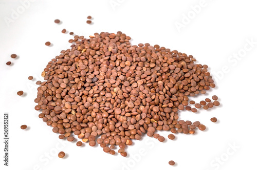 lentil seed, kernel on white background, selective focus