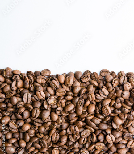 Roasted coffee beans pile isolated on white background from top view