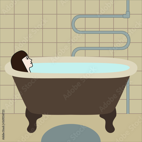 Woman lying in the bath in the bathroom