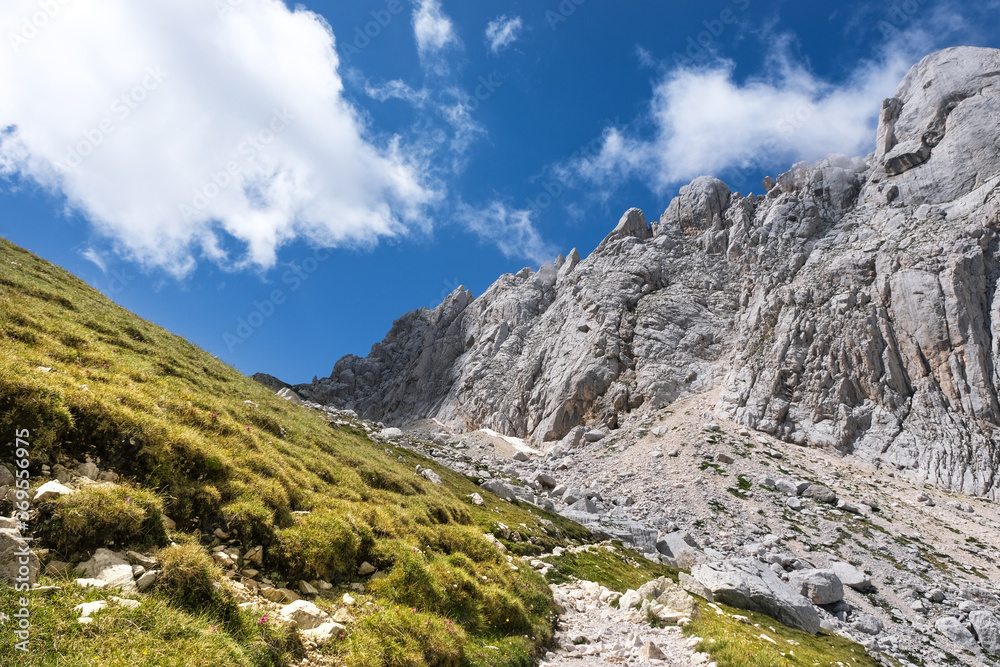 path that leads to the franchetti refuge on the gran sasso d'italia with a view of the small horn wall