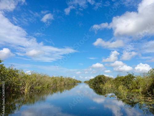 Miami Everglades, sky and clouds reflected in water