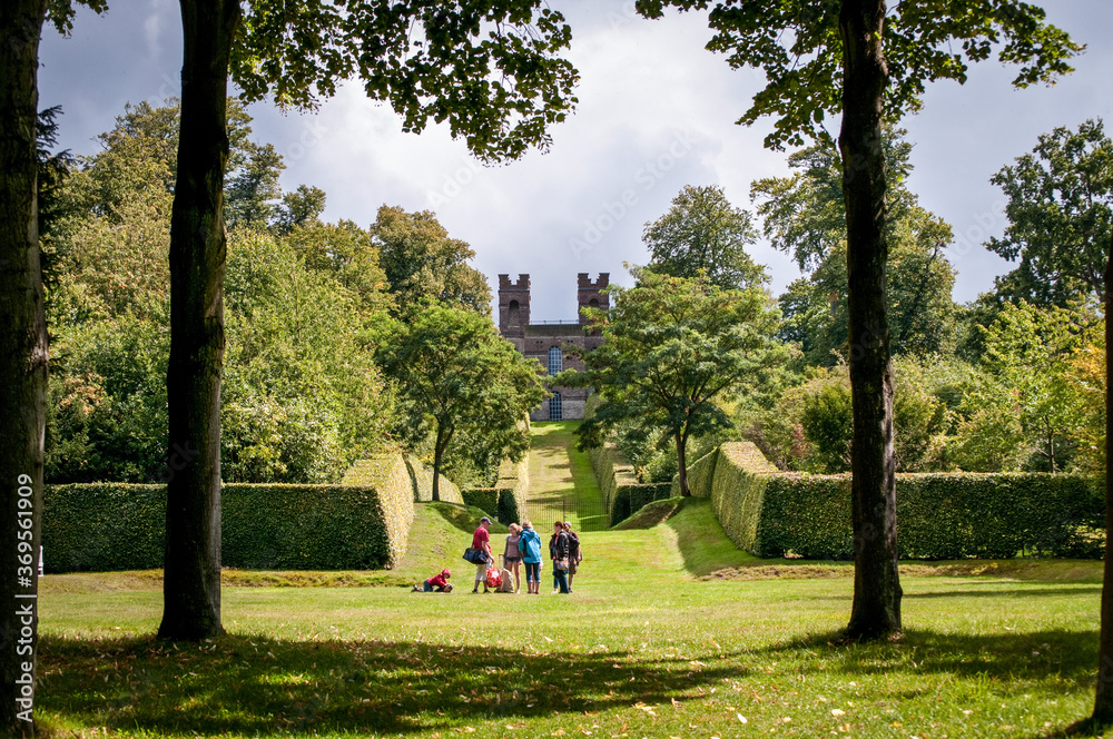 Landscaped vista with Belvedere Tower, at the end of it, Claremont Landscape Garden, Esher, Surrey, UK