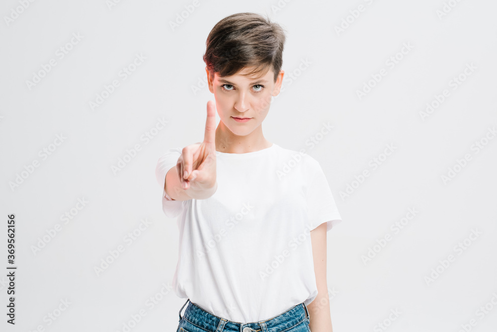 Portrait Of A Serious Young Woman Showing Stop Gesture Portrait Of A Serious Young Woman Showing Stop Gesture