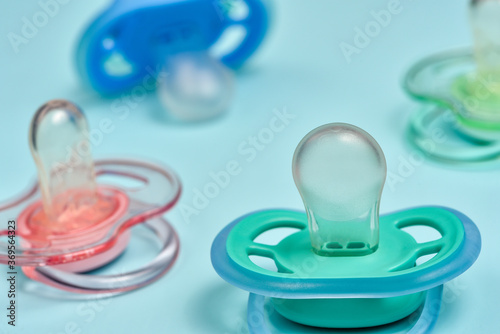 Fotótapéta One blue plastic nipple pacifier soother on a blue background, space for text