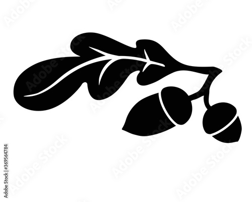 Acorns and oak leaf - black vector silhouette for pictogram or logo. Silhouette of an oak leaf and two acorns - sign or icon. Oak branch
