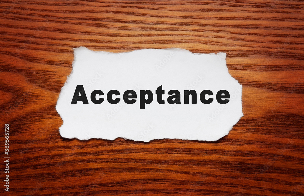 Accept lettering on a sheet of white paper on a wooden background. Accept lettering on a sheet of white paper on a wooden background.