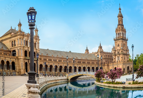 A view along the southern side of the Plaza de Espana in Seville, Spain in the early morning in summertime