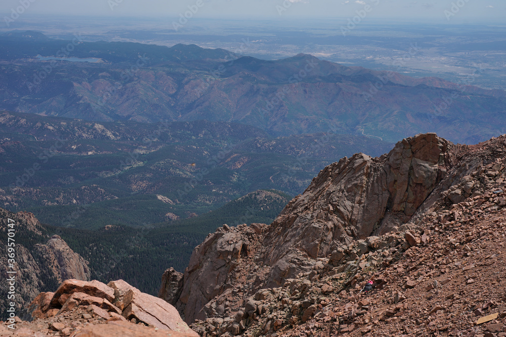 View from atop Pikes peak overlooking the surrounding colorado countryside. Fourteener seeing for miles