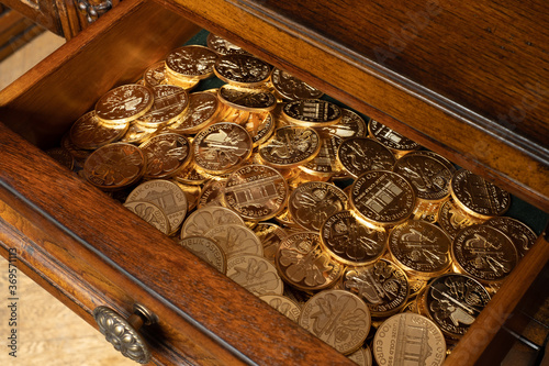 Austrian Philharmoniker pure gold coins hidden in old wooden drawer. Conservative investor's portfolio. photo