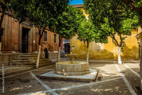 The peace and tranquility of an inner courtyard in Seville, Spain in the summertime photo