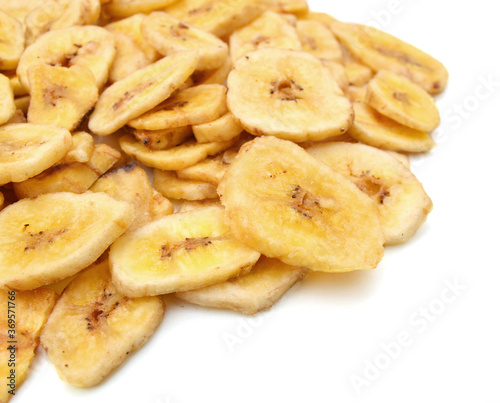 Banana chips on white background