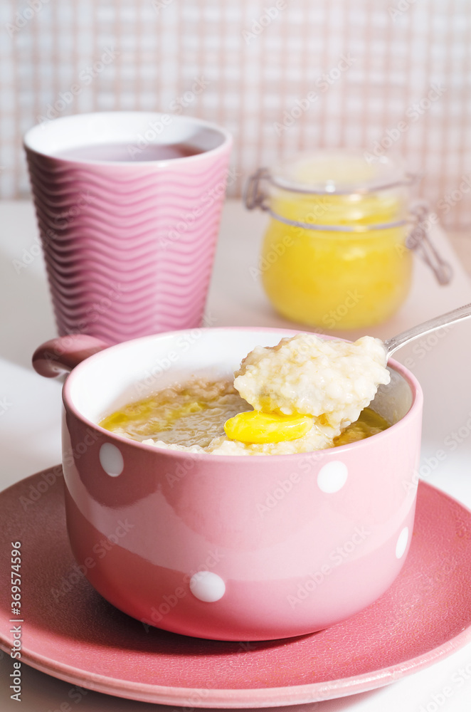 Oatmeal porridge for Breakfast with butter and honey. Vegan food, healthy Breakfast Oatmeal porridge for Breakfast with butter and honey. Vegan food, healthy Breakfast