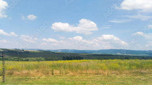 Landcscape hight mountains. Landscape in the fields. Beautiful blue sky with cloud.