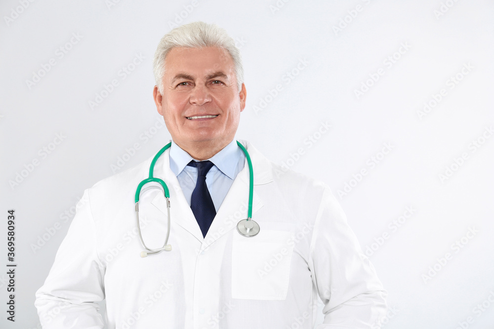 Portrait of senior doctor with stethoscope on white background Portrait of senior doctor with stethoscope on white background